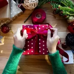 hand wrapping a gift